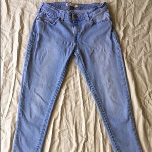 A pair of light blue skinny jeans